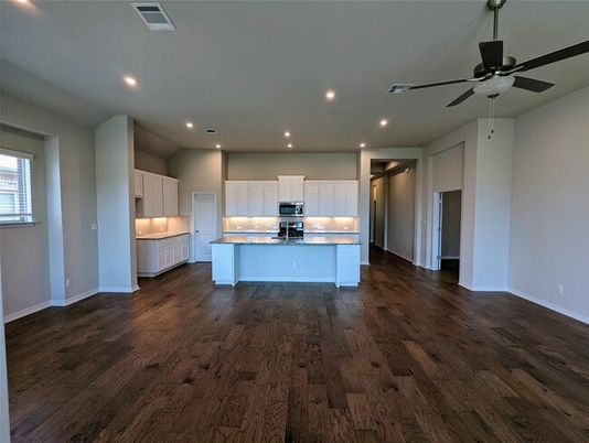 Empty room, Interior, Kitchen, Recessed Lighting, Stainless Steel Appliances, Wood Texture Flooring