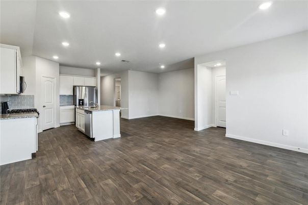 Empty room, Interior, Kitchen, Recessed Lighting, Stainless Steel Appliances, Wood Texture Flooring