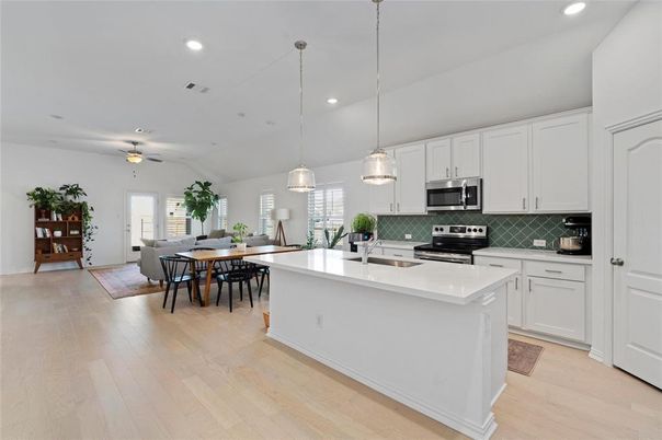 Dining room, Interior, Kitchen, Pendant Lights, Recessed Lighting, Stainless Steel Appliances, Wood Texture Flooring