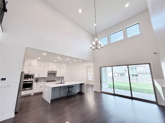 Chandelier, Interior, Kitchen, Pendant Lights, Recessed Lighting, Stainless Steel Appliances, Wood Texture Flooring