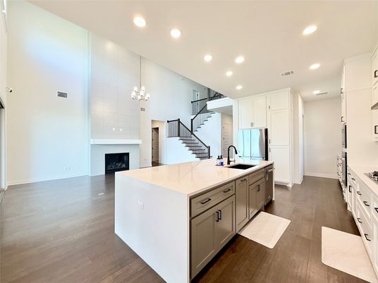 Chandelier, Fireplace, Interior, Kitchen, Pendant Lights, Recessed Lighting, Wood Texture Flooring