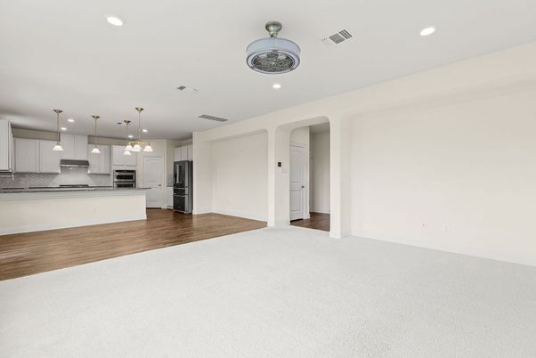 Empty room, Interior, Kitchen, Pendant Lights, Recessed Lighting, Stainless Steel Appliances, Wood Texture Flooring