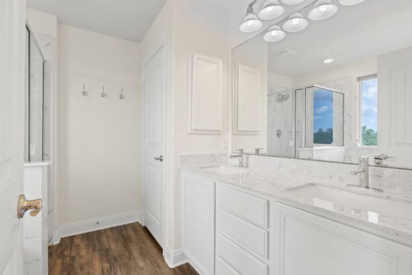 Bathroom, Dual Sink Vanities, Glass Shower, Interior, Recessed Lighting, Wood Texture Flooring