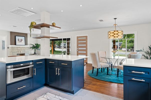 Dining room, Interior, Kitchen, Pendant Lights, Recessed Lighting, Stainless Steel Appliances, Wood Texture Flooring