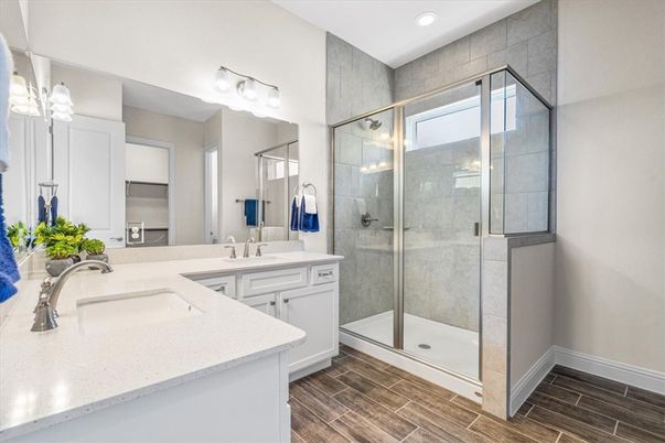 Bathroom, Dual Sink Vanities, Glass Shower, Interior, Recessed Lighting, Wood Texture Flooring