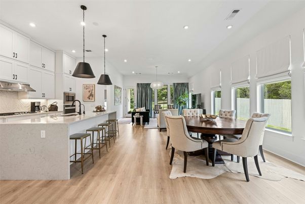 Dining room, Interior, Kitchen, Pendant Lights, Recessed Lighting, Stainless Steel Appliances, Wood Texture Flooring