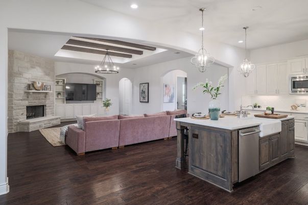 Chandelier, Fireplace, Interior, Kitchen, Living room, Pendant Lights, Recessed Lighting, Stainless Steel Appliances, Stone Walls, Wooden Beams, Wood Texture Flooring
