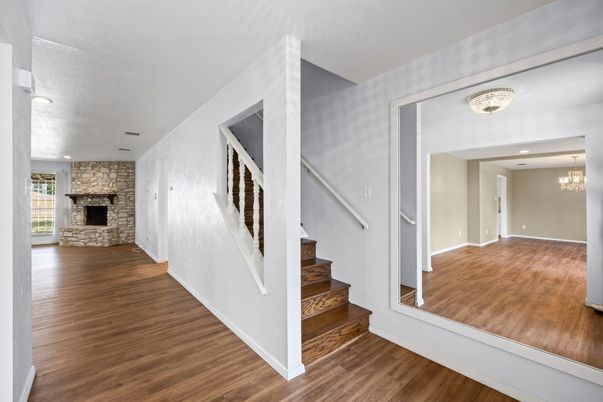Chandelier, Empty room, Fireplace, Interior, Recessed Lighting, Wood Texture Flooring