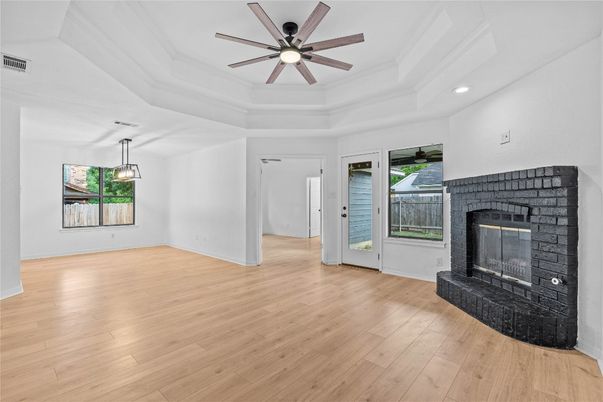 Empty room, Fireplace, Interior, Pendant Lights, Recessed Lighting, Wood Texture Flooring