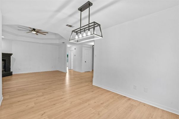 Empty room, Fireplace, Interior, Pendant Lights, Recessed Lighting, Wood Texture Flooring