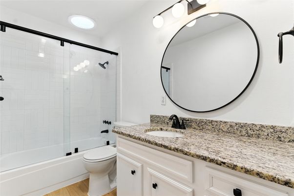 Bathroom, Dual Sink Vanities, Glass Shower, Interior, Recessed Lighting, Wood Texture Flooring