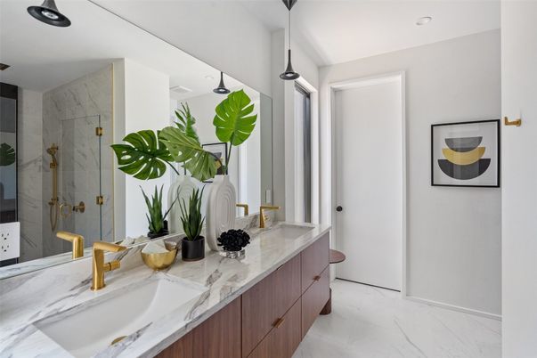 Bathroom, Dual Sink Vanities, Glass Shower, Interior, Marble, Marble Walls, Pendant Lights, Recessed Lighting