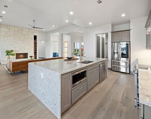 Fireplace, Interior, Kitchen, Recessed Lighting, Stainless Steel Appliances, Stone Walls, Wood Texture Flooring
