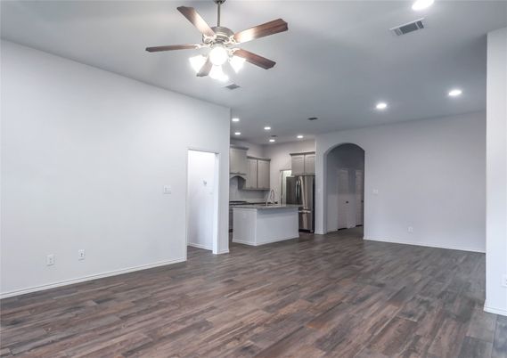 Empty room, Interior, Kitchen, Recessed Lighting, Stainless Steel Appliances, Wood Texture Flooring
