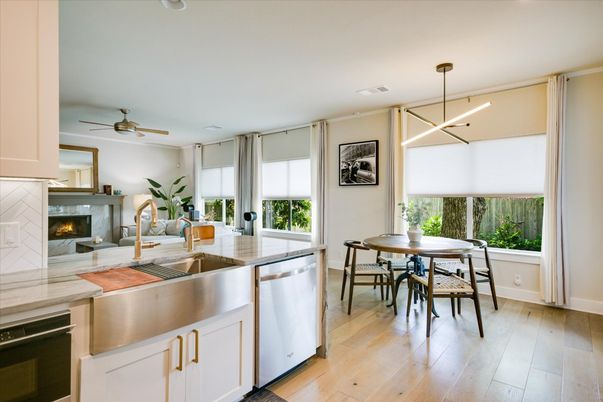 Dining room, Fireplace, Interior, Kitchen, Pendant Lights, Recessed Lighting, Stainless Steel Appliances, Wood Texture Flooring