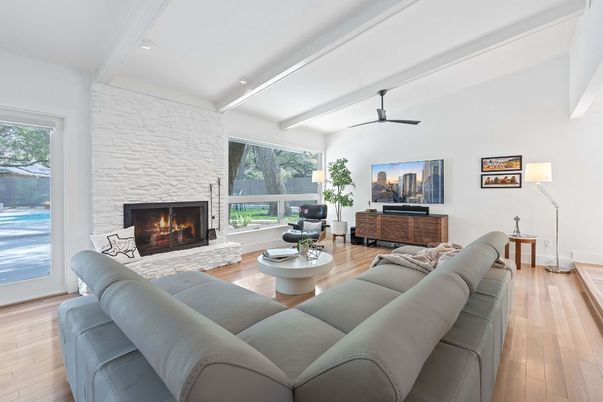 Fireplace, Interior, Living room, Recessed Lighting, Stone Walls, Wood Texture Flooring
