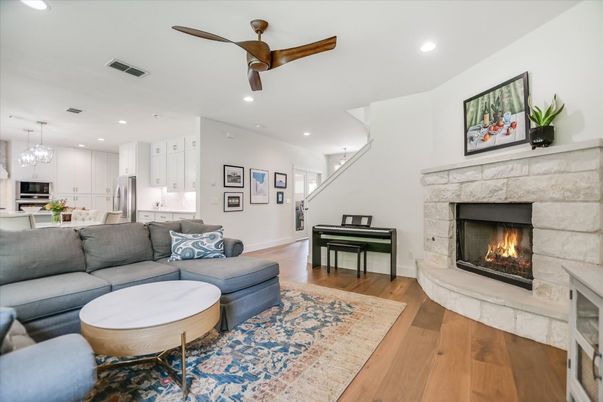 Chandelier, Fireplace, Interior, Kitchen, Living room, Pendant Lights, Piano, Recessed Lighting, Wood Texture Flooring