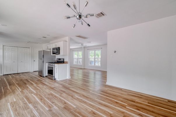 Empty room, Interior, Kitchen, Stainless Steel Appliances, Wood Texture Flooring
