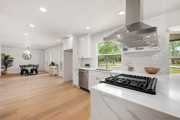 Dining room, Interior, Kitchen, Pendant Lights, Recessed Lighting, Stainless Steel Appliances, Wood Texture Flooring