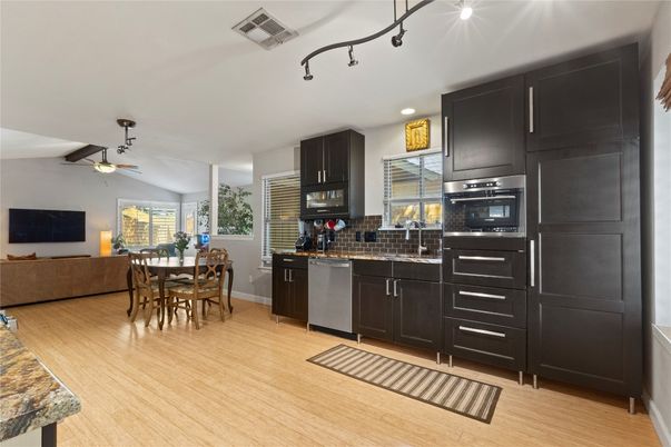 Dining room, Interior, Kitchen, Recessed Lighting, Stainless Steel Appliances, Wood Texture Flooring
