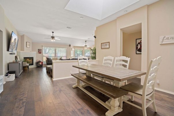 Dining room, Fireplace, Interior, Living room, Pendant Lights, Recessed Lighting, Wood Texture Flooring