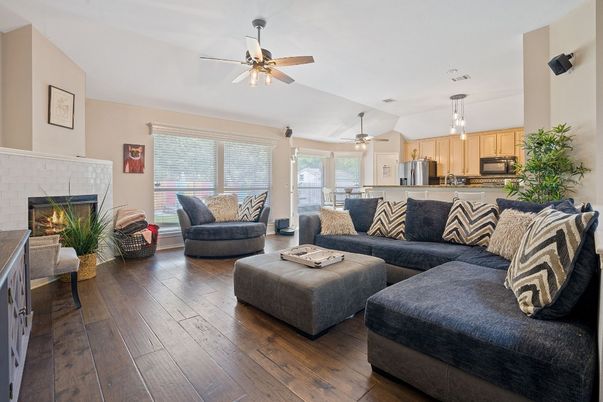 Fireplace, Interior, Kitchen, Living room, Pendant Lights, Stainless Steel Appliances, Wood Texture Flooring