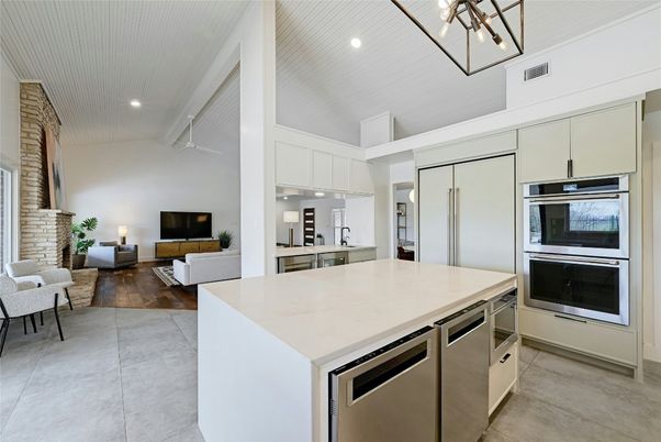 Fireplace, Interior, Kitchen, Living room, Pendant Lights, Recessed Lighting, Stainless Steel Appliances, Wood Texture Flooring