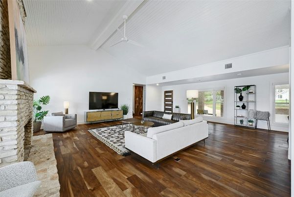 Fireplace, Interior, Living room, Recessed Lighting, Stone Walls, Wood Texture Flooring