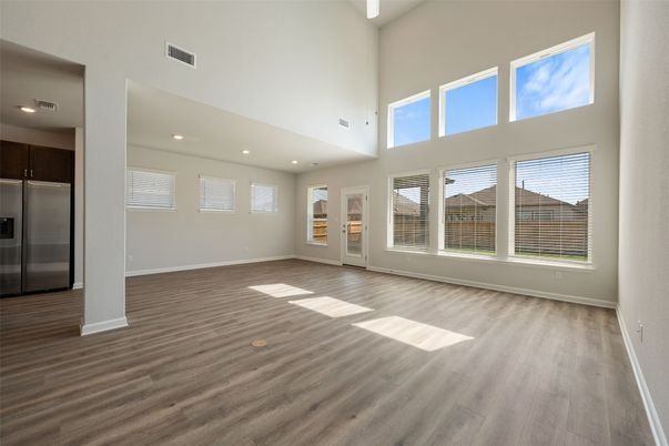 Empty room, Interior, Kitchen, Recessed Lighting, Stainless Steel Appliances, Wood Texture Flooring
