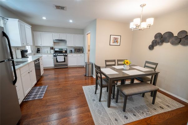 Dining room, Interior, Kitchen, Pendant Lights, Recessed Lighting, Stainless Steel Appliances, Wood Texture Flooring