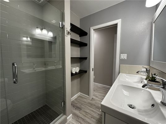Bathroom, Dual Sink Vanities, Glass Shower, Interior, Wood Texture Flooring