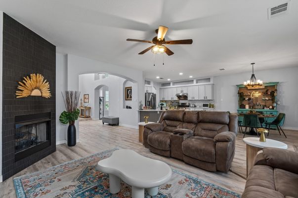 Chandelier, Dining room, Fireplace, Interior, Kitchen, Living room, Pendant Lights, Recessed Lighting, Stainless Steel Appliances, Wood Texture Flooring