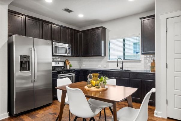 Dining room, Interior, Kitchen, Recessed Lighting, Stainless Steel Appliances, Wood Texture Flooring