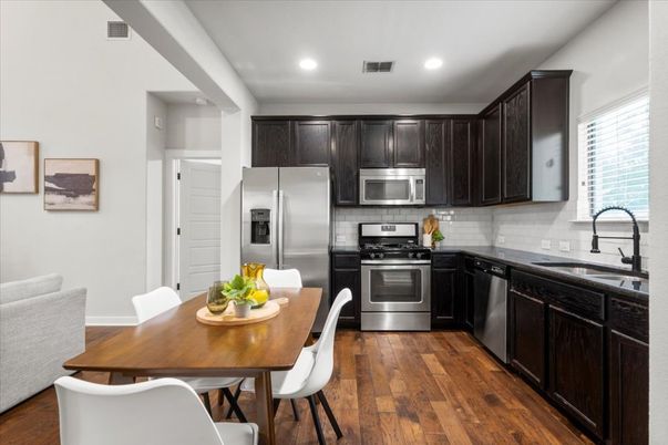 Dining room, Interior, Kitchen, Recessed Lighting, Stainless Steel Appliances, Wood Texture Flooring