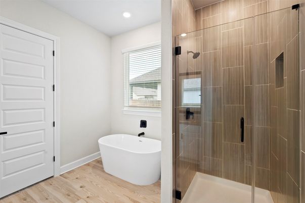 Bathroom, Free Standing Baths, Glass Shower, Interior, Recessed Lighting, Wood Texture Flooring
