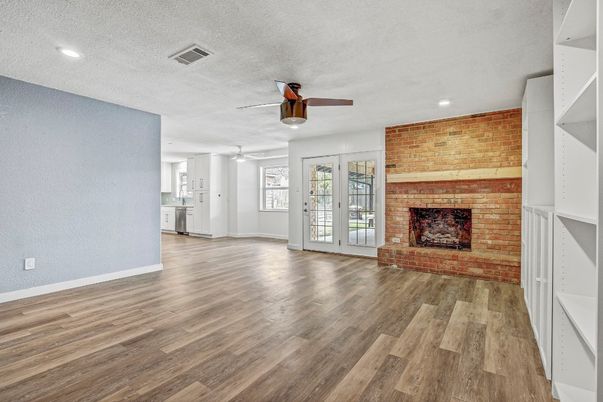 Empty room, Fireplace, Interior, Recessed Lighting, Stone Walls, Wood Texture Flooring