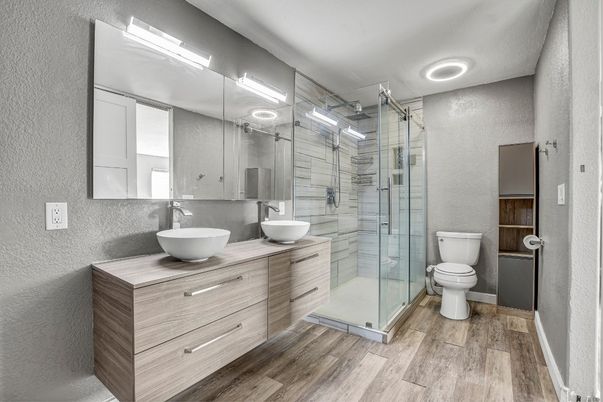 Bathroom, Dual Sink Vanities, Glass Shower, Interior, Recessed Lighting, Wood Texture Flooring