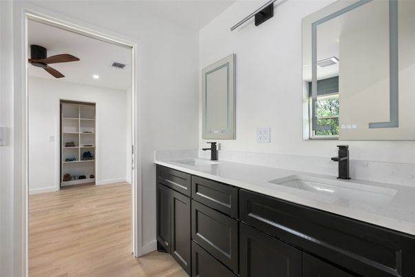 Bathroom, Dual Sink Vanities, Interior, Recessed Lighting, Wood Texture Flooring