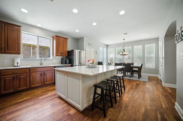 Dining room, Interior, Kitchen, Pendant Lights, Recessed Lighting, Stainless Steel Appliances, Wood Texture Flooring