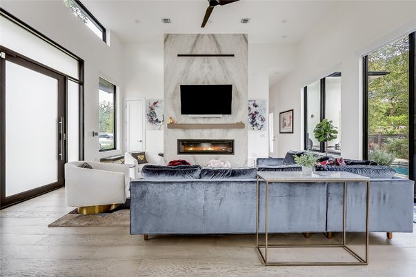 Fireplace, Interior, Living room, Marble Walls, Recessed Lighting, Wood Texture Flooring