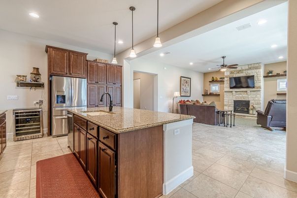 Fireplace, Interior, Kitchen, Living room, Pendant Lights, Recessed Lighting, Stainless Steel Appliances, Stone Walls