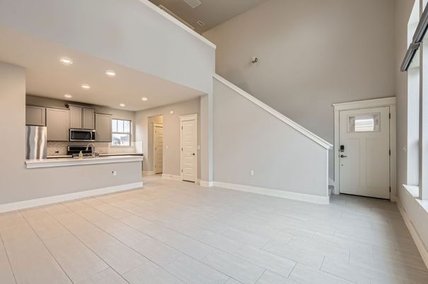 Empty room, Interior, Kitchen, Recessed Lighting, Stainless Steel Appliances, Wood Texture Flooring