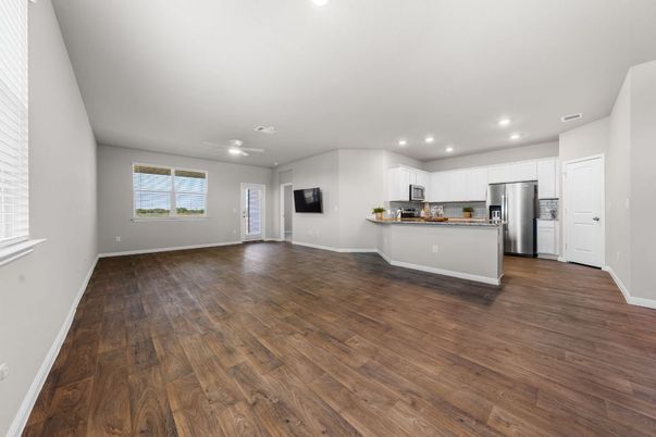 Empty room, Interior, Kitchen, Recessed Lighting, Stainless Steel Appliances, Wood Texture Flooring