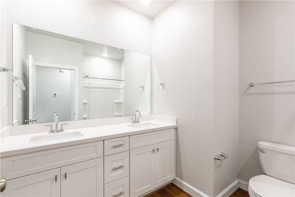 Bathroom, Dual Sink Vanities, Interior, Recessed Lighting, Wood Texture Flooring