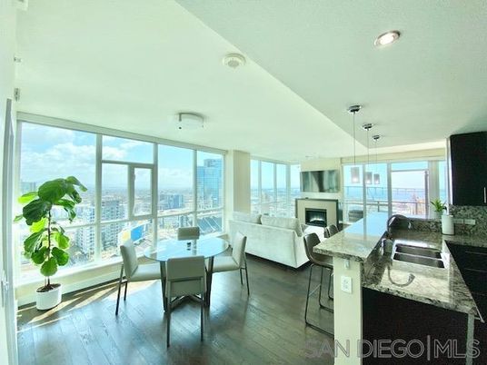 Dining room, Fireplace, Interior, Living room, Pendant Lights, Recessed Lighting, Water, Wood Texture Flooring