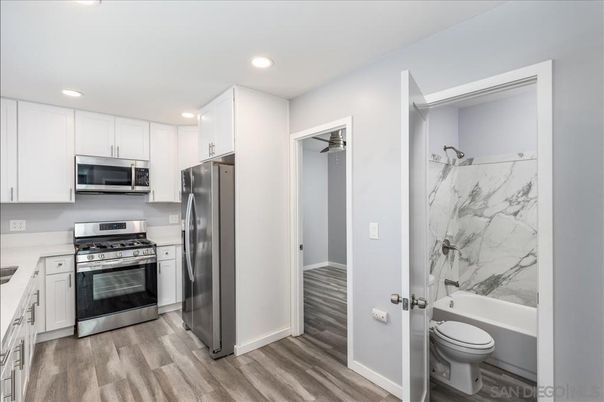 Interior, Kitchen, Recessed Lighting, Stainless Steel Appliances, Wood Texture Flooring