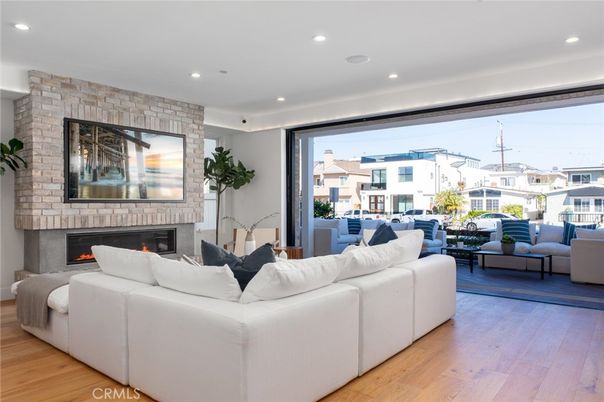 Fireplace, Interior, Living room, Recessed Lighting, Stone Walls, Wood Texture Flooring