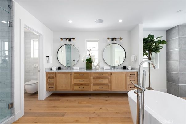 Bathroom, Dual Sink Vanities, Free Standing Baths, Glass Shower, Interior, Recessed Lighting, Wood Texture Flooring