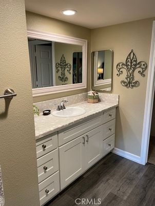 Bathroom, Dual Sink Vanities, Interior, Recessed Lighting, Wood Texture Flooring