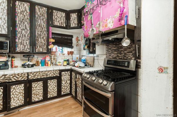 Interior, Kitchen, Stainless Steel Appliances, Tile Countertops, Wood Texture Flooring
